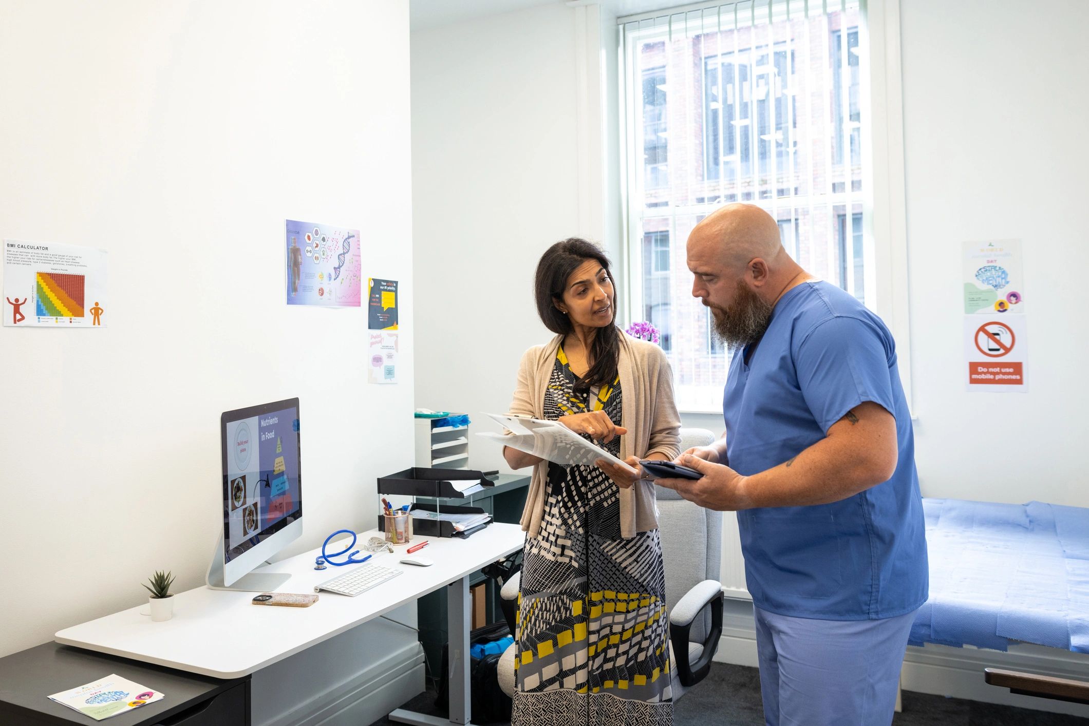 Medical team reviewing patient information during consultation