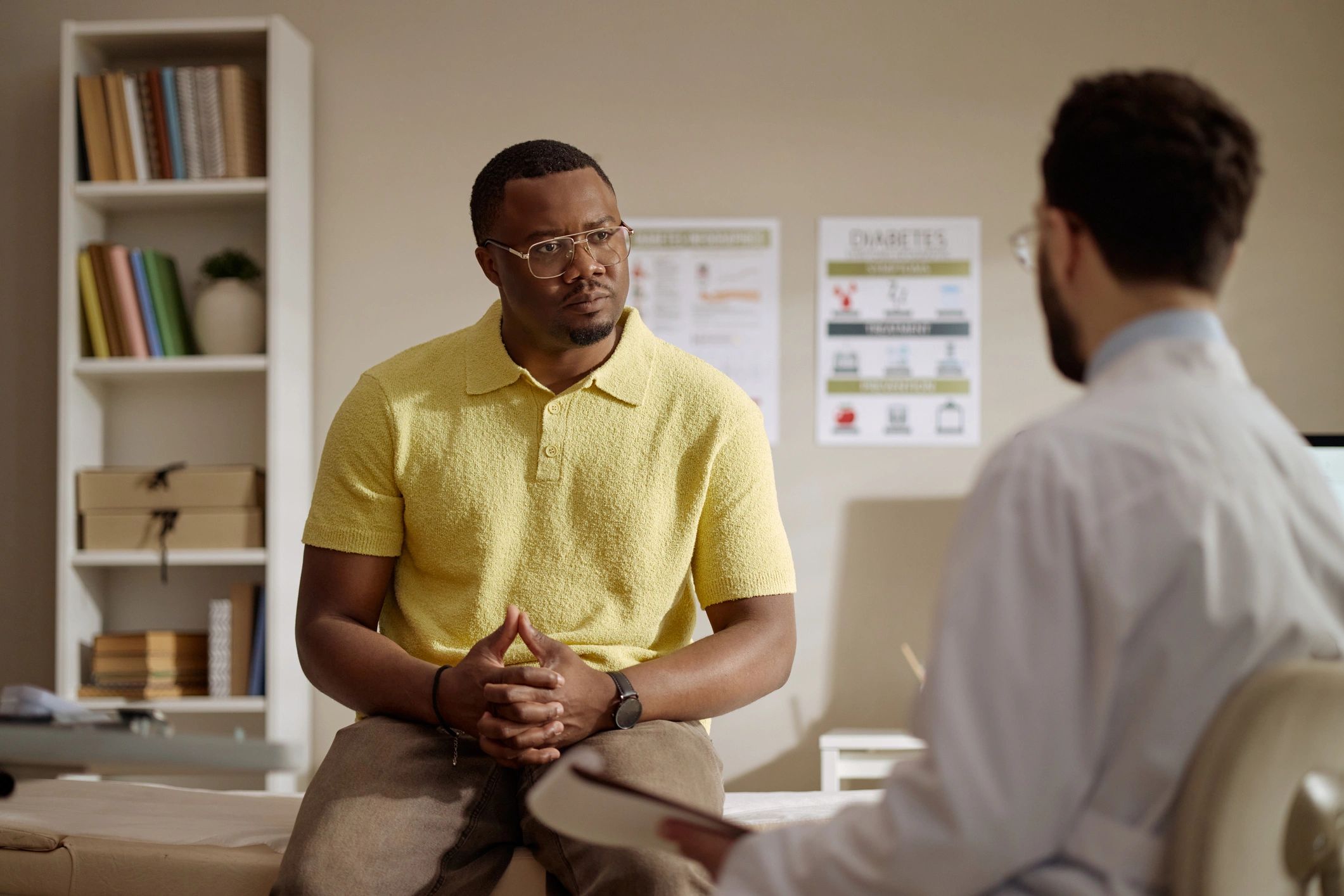 Doctor consulting with patient during musculoskeletal evaluation